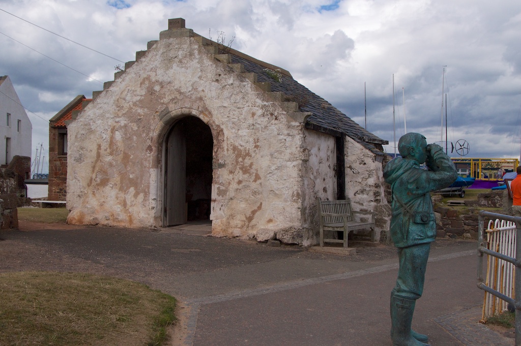 St Andrew's Auld Kirk. You can just glimpse the harbour through the gap on the left. That's a modern statue, by the way!